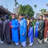 Artists, ambassadors bringing back “ao dai” for men