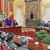 President receives Lao people with contributions to VN revolution