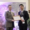 Vietnamese scholar presented with French chevalier