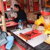 Tet event features folk art, calligraphy