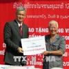 Lao association presents gifts to flood-hit central localities