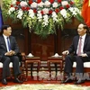 President Tran Dai Quang meets with Lao PM Thongloun Sisoulith