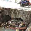 Litter in canals, sewers worsens floods in HCM City