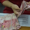 Indonesia strives to stop currency’s sharp plunge against USD