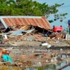 Death toll from Indonesia quakes, tsunami hits over 830