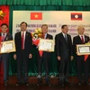 Leaders of Dong Nai honoured with Lao Order of Independence