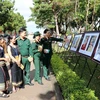 Photo exhibition honours late painter Xu Man 