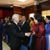 Top leader meets Vietnamese expatriates in Laos