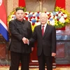 Top leader welcomes, holds talks with DPRK Chairman