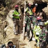 Indonesia stops search for mine collapse victims