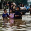 Indonesian floods kill two, force hundreds to evacuate