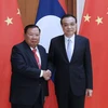 China willing to step up cooperation with Laos