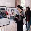 Photo exhibitions on air pollution tour universities in HCM City