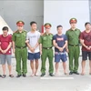 Vietnam hands over four wanted suspects to China