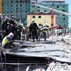 Cambodia arrests four suspects in building collapse