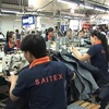High-level Swiss delegation visits garment factory in Dong Nai