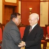 Party leader, President receives Lao counterpart