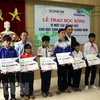 Quang Nam: SonKim Land presents flood-hit students with scholarships