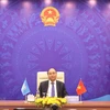 Prime Minister Nguyen Xuan Phuc addresses the UNSC debate from Hanoi (Photo: VNA)