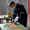 Philippine artist turns waste into paintings