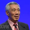 Singaporean PM affirms policy to stay open