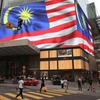 Malaysia allows 11 business sectors to reopen