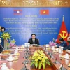 Vietnamese, Lao parties review theoretical exchange