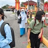 Malaysian students come back to school after six months