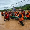 Seven dead, more than 50,000 evacuated in Malaysia floods