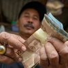 Indonesia’s central bank raises rates again to curb inflation