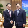 PM Pham Minh Chinh receives Lao Deputy PM, Foreign Minister