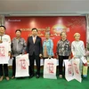 Tet presents given to revolution contributors, poor people in Cambodia