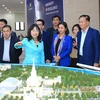 Lao Party officials visit Hanoi craft village, university