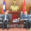 Vietnam shares experience in solving economic difficulties with Laos