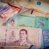 Malaysian, Thai economies suffer as currencies slide