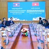 Vietnam, Laos to step up sharing mass mobilisation experience