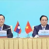 Vietnamese, Lao PMs co-chair bilateral investment cooperation conference in Hanoi