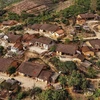 Nung ethnic hamlet attracts tourists with traditional rammed earth houses