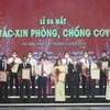 Representatives of businesses donating to the COVID-19 vaccine fund at the launch of the fund (Photo: VietnamPlus)