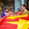 Visiting the village with more than 70 years of sewing national flags