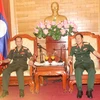 Vietnam y Laos intercambien experiencias sobre política militar