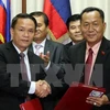 Agencias vietnamitas y laosianas de noticias fortalecen cooperación