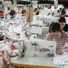 Asisten a exportadores vietnamitas de productos textiles