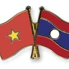 Vietnam y Laos buscan medidas para fomentar cooperación comercial