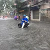 [Fotos] Fuertes lluvias inundan Hanoi 