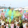 [Fotos] Miles de personas participan en colorida carrera a favor de las víctimas del Agente Naranja