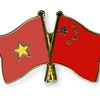 Organizaciones de masas de Vietnam y China comparten experiencias 