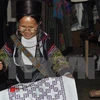 Minorías étnicas hacen fortuna con oficio tradicional de tejido de brocado