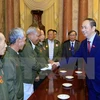 Presidente Dai Quang recibe a laosianos con contribuciones a revolución vietnamita
