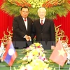 Máximo dirigente partidista de Vietnam conversa con secretario general de PPRL y presidente de Laos
